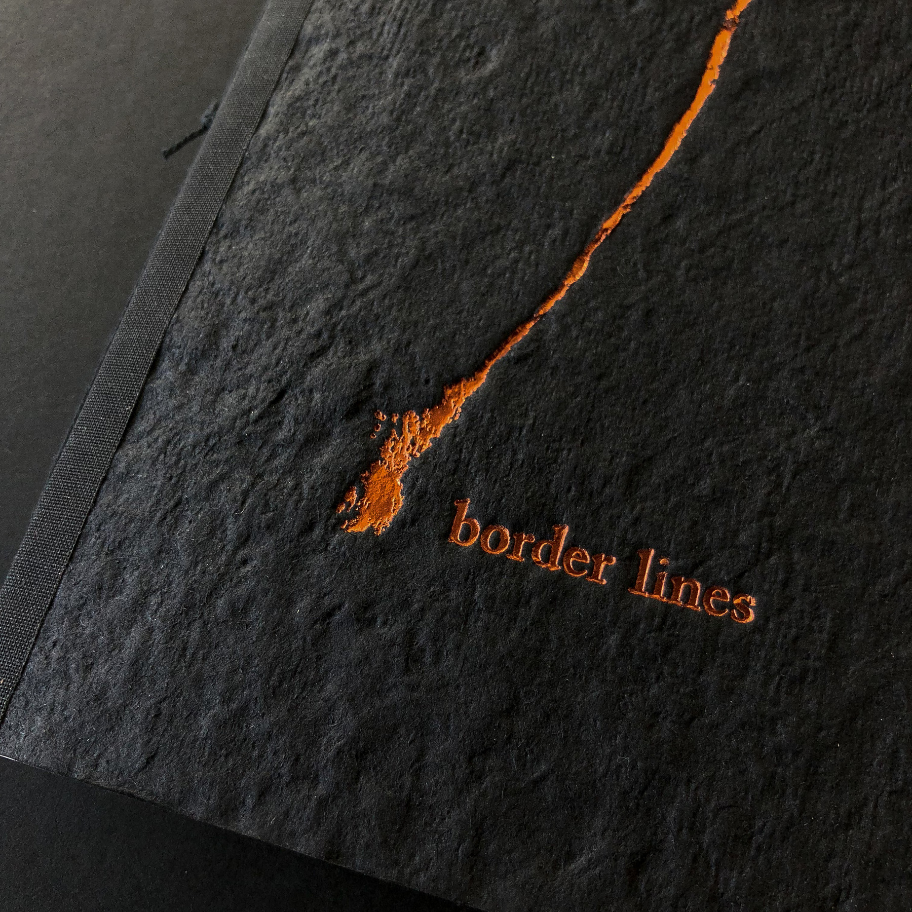 Copper foil stamped book by Lloyd Jones on handmade paper cover 1