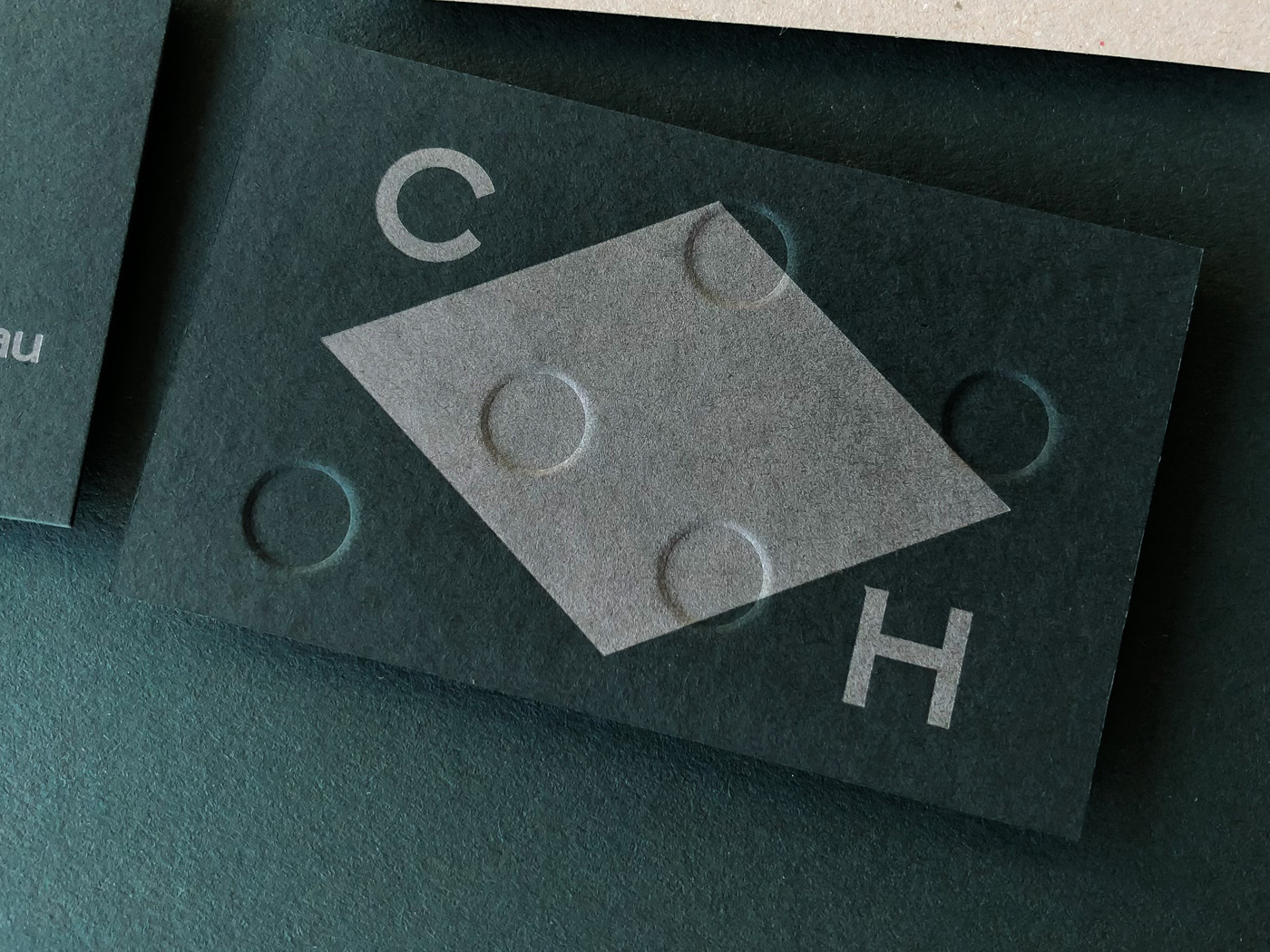 Embossed debossed letterpress business cards for Clubhouse on Colorplan Racing Green
